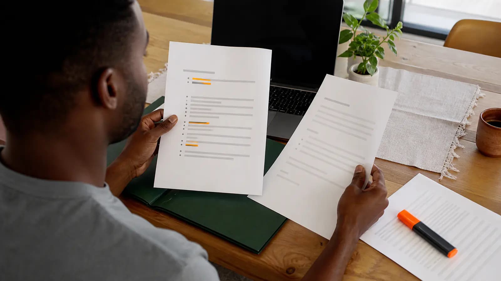Job seeker comparing two simplified CV pages and highlighting relevant evidence